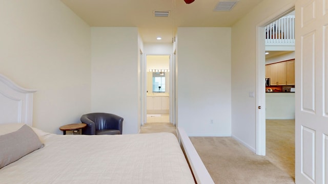 carpeted bedroom featuring connected bathroom and ceiling fan