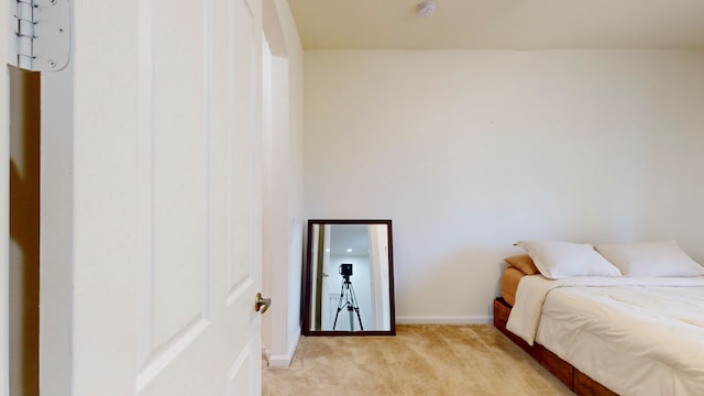 bedroom with light carpet