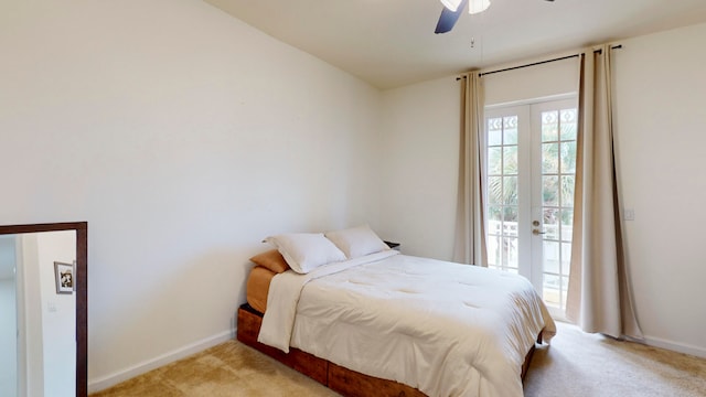 bedroom with light carpet, french doors, access to exterior, and ceiling fan