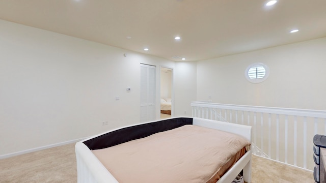 bedroom with light colored carpet