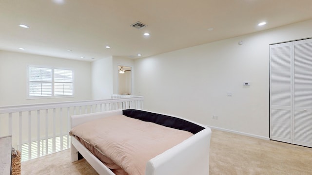 carpeted bedroom featuring a closet