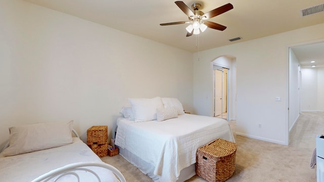 bedroom featuring ceiling fan and light carpet