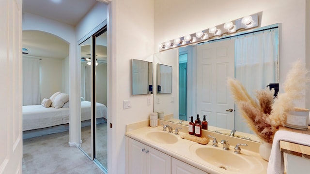 bathroom featuring vanity and ceiling fan