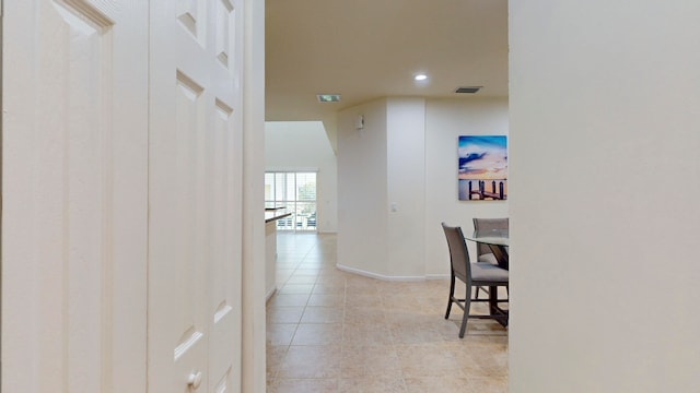 hallway with light tile patterned floors