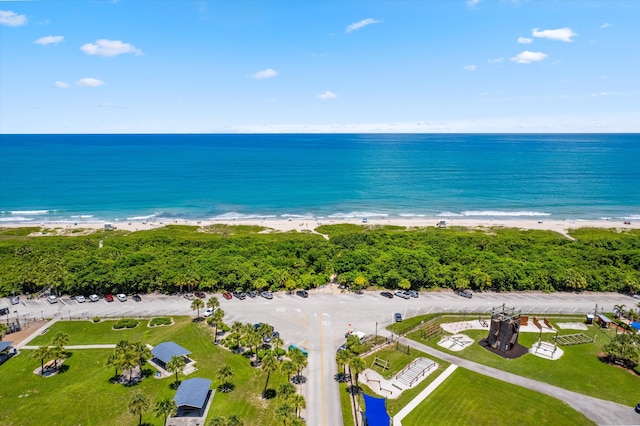 aerial view featuring a view of the beach and a water view