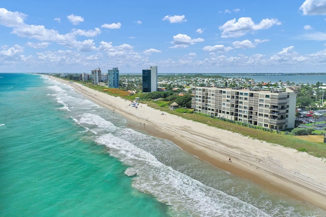 bird's eye view featuring a water view and a view of the beach