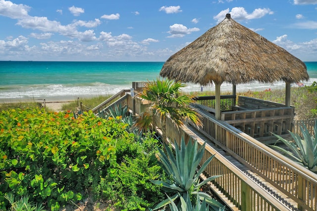 water view with a beach view and a gazebo