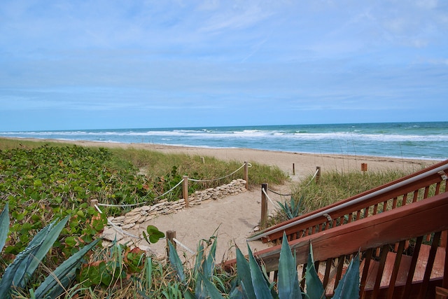 view of water feature with a beach view