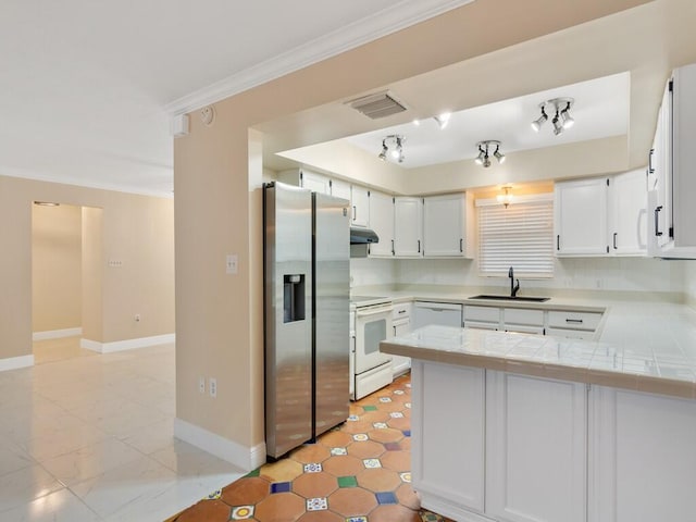 kitchen with white cabinetry, white appliances, kitchen peninsula, crown molding, and sink