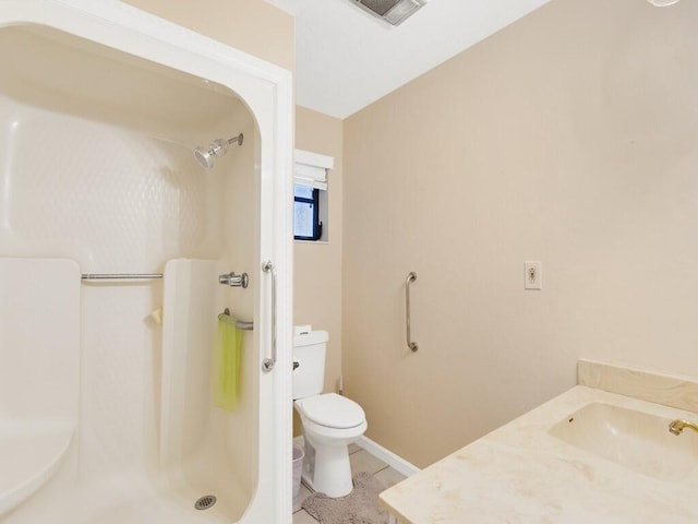 bathroom featuring a shower, toilet, sink, and tile patterned floors