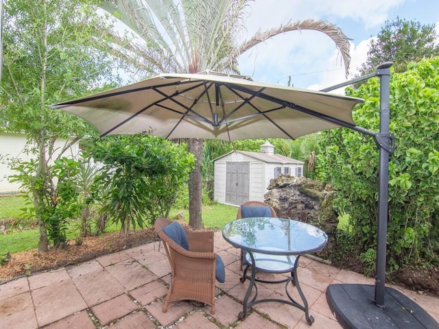 view of patio with a storage unit