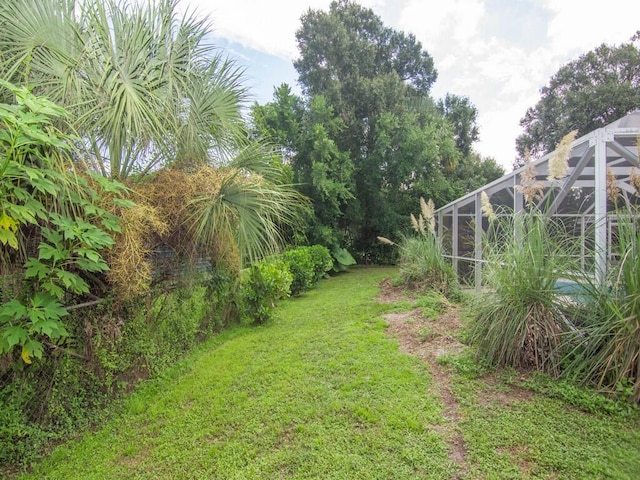 view of yard featuring a lanai