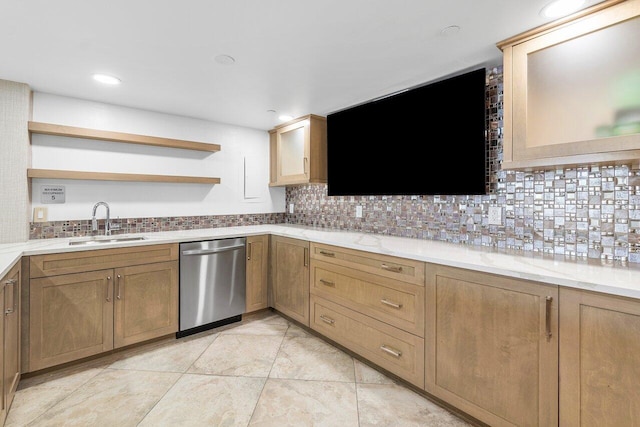 kitchen featuring light tile patterned floors, dishwasher, tasteful backsplash, and sink