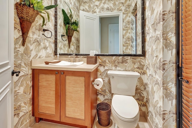 bathroom with vanity and toilet