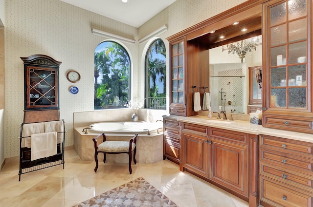 bathroom featuring vanity and shower with separate bathtub