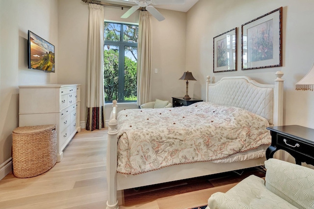 bedroom with light wood-type flooring and ceiling fan