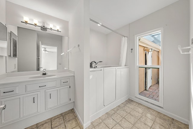 bathroom featuring vanity, ceiling fan, tile patterned floors, and walk in shower