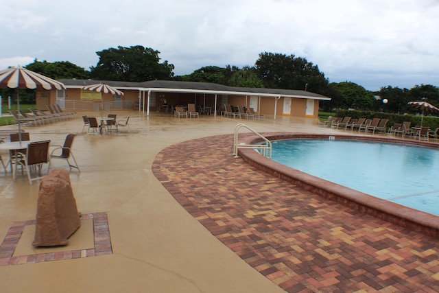 view of swimming pool with a patio area