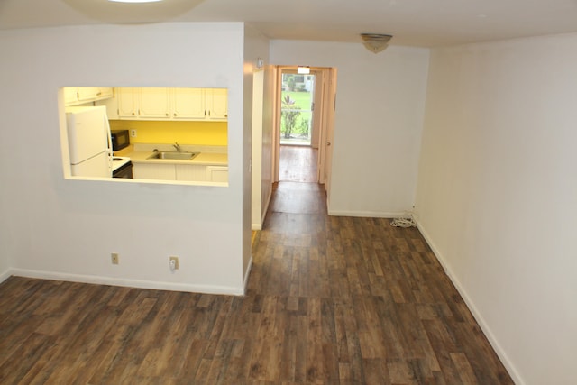 interior space featuring dark hardwood / wood-style flooring and sink