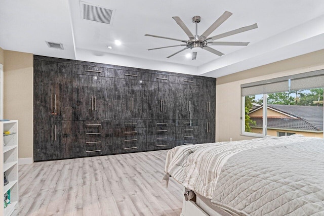 bedroom featuring recessed lighting, a ceiling fan, visible vents, and light wood-type flooring