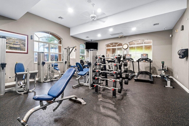 gym with baseboards, ceiling fan, recessed lighting, and visible vents