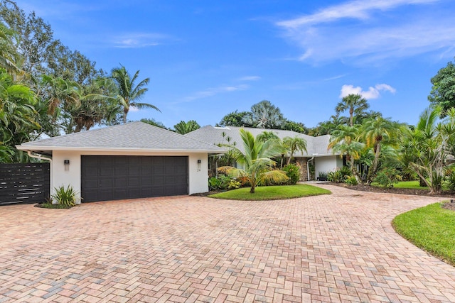 ranch-style house featuring a garage