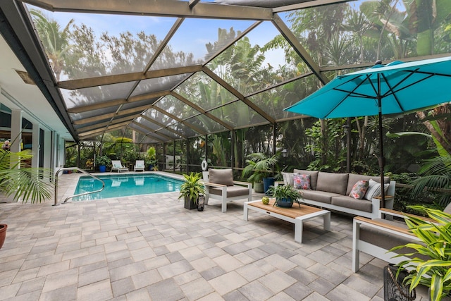 view of pool featuring outdoor lounge area, a patio, and a lanai