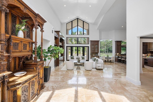 living room with a towering ceiling