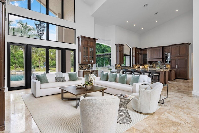 living room featuring high vaulted ceiling