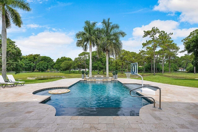 view of swimming pool with a yard, an in ground hot tub, and a patio area