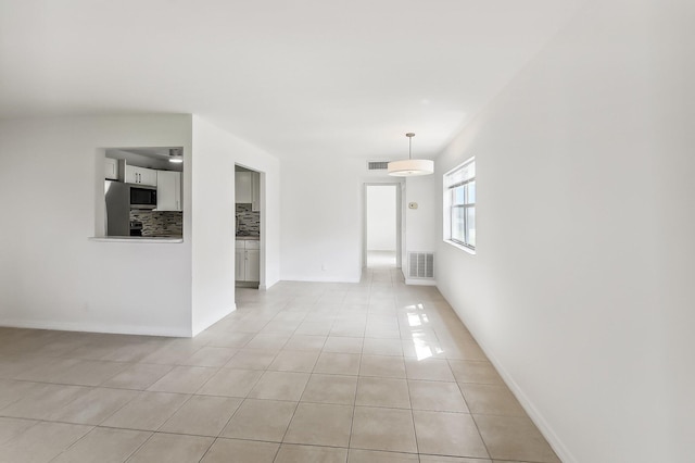 empty room featuring light tile patterned floors