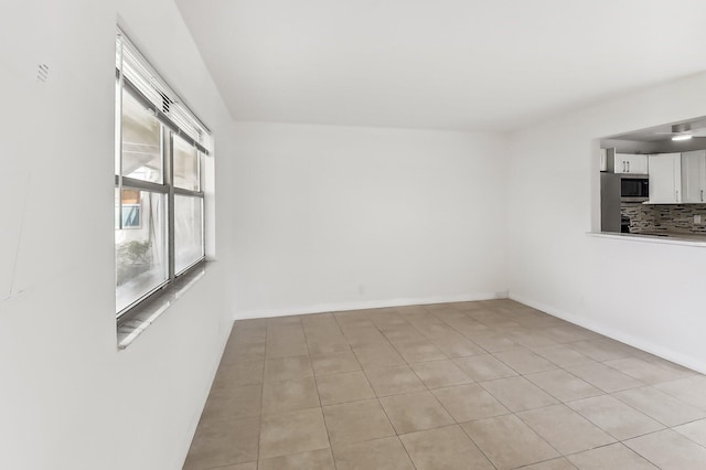 view of tiled spare room