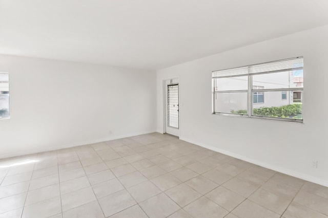 empty room with light tile patterned floors