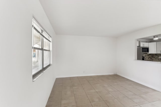 view of tiled spare room