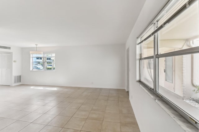 unfurnished room with light tile patterned floors