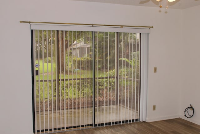 interior space with a healthy amount of sunlight, hardwood / wood-style floors, and ceiling fan