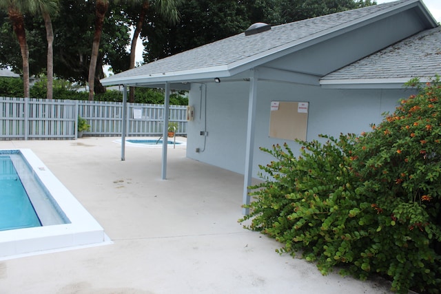 view of swimming pool with a patio area