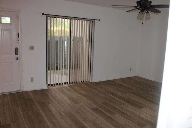 interior space with ceiling fan and dark hardwood / wood-style flooring