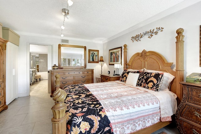 tiled bedroom with ornamental molding and a textured ceiling