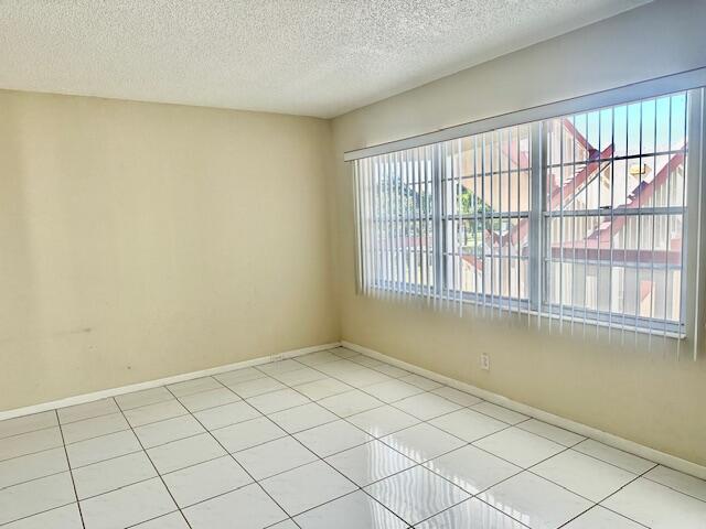 view of tiled spare room