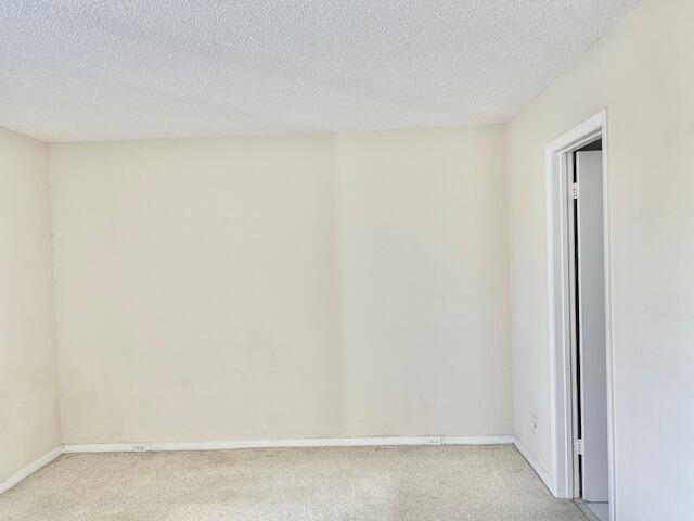 spare room featuring a textured ceiling