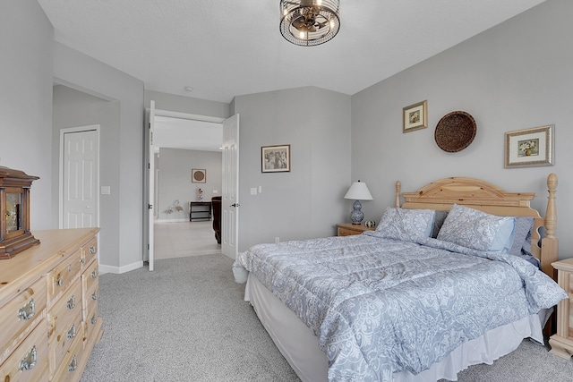 bedroom featuring light carpet