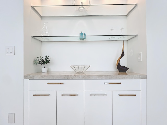 bar with white cabinetry