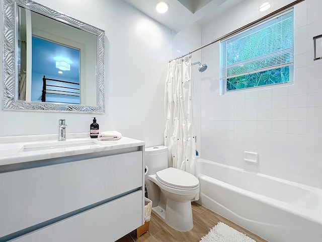 full bathroom featuring wood-type flooring, vanity, toilet, and shower / bath combo