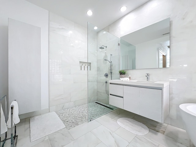 bathroom featuring shower with separate bathtub and vanity