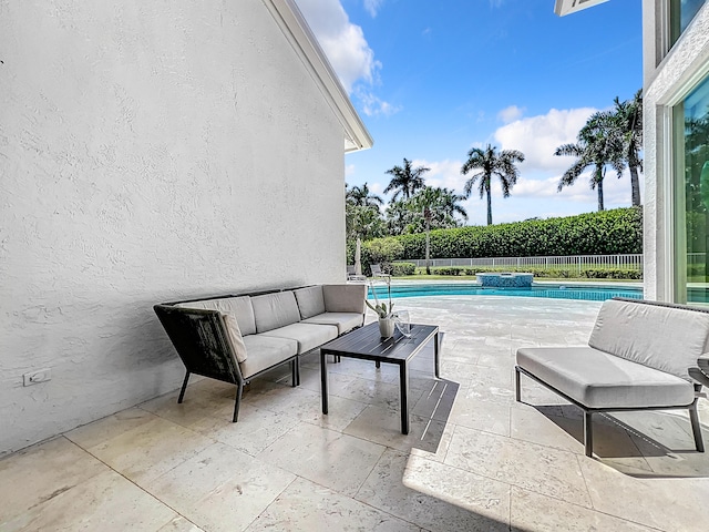 view of patio featuring an outdoor living space and a fenced in pool