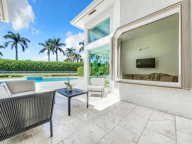 view of patio / terrace featuring a fenced in pool