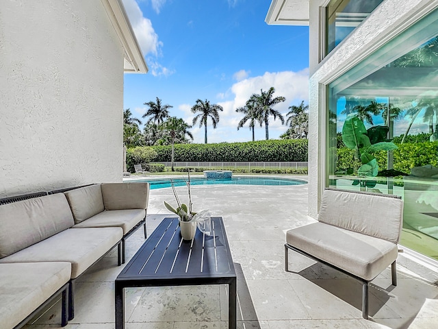 view of pool with outdoor lounge area and a patio