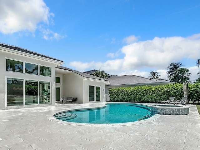 view of pool featuring a patio