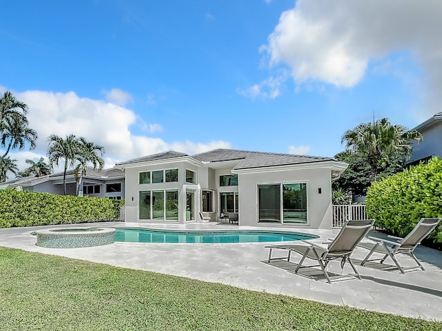 view of swimming pool featuring a patio and a lawn